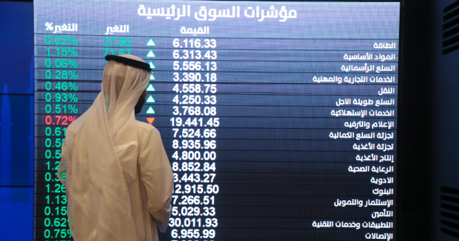 ||||||||A Saudi broker monitors the stock market at the Arab National Bank in the Saudi capital Riyadh on December 11, 2019. - Saudi Aramco's shares soared on their debut on the domestic stock exchange Wednesday, becoming the world's biggest listed company worth $1.88 trillion after a record-breaking IPO. Aramco had priced the initial public offering at 32 riyals ($8.53) per share, raising $25.6 billion and eclipsing Alibaba's $25 billion IPO of 2014 to become the world's largest. (Photo by Fayez Nureldine / AFP)