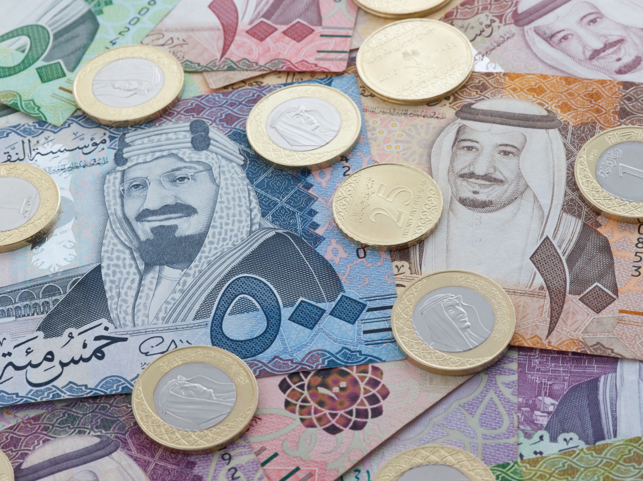 Saudi Riyal Banknotes and Coins showing King Salman of Saudi Arabia